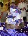 3 TIER ROLLED FONDANT WITH PURPLE FLOWERS